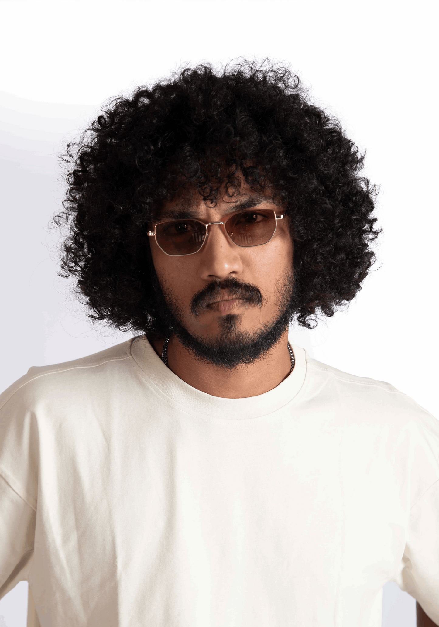 Man wearing Stylera oversized almond milk t-shirt with round neck and casual fit