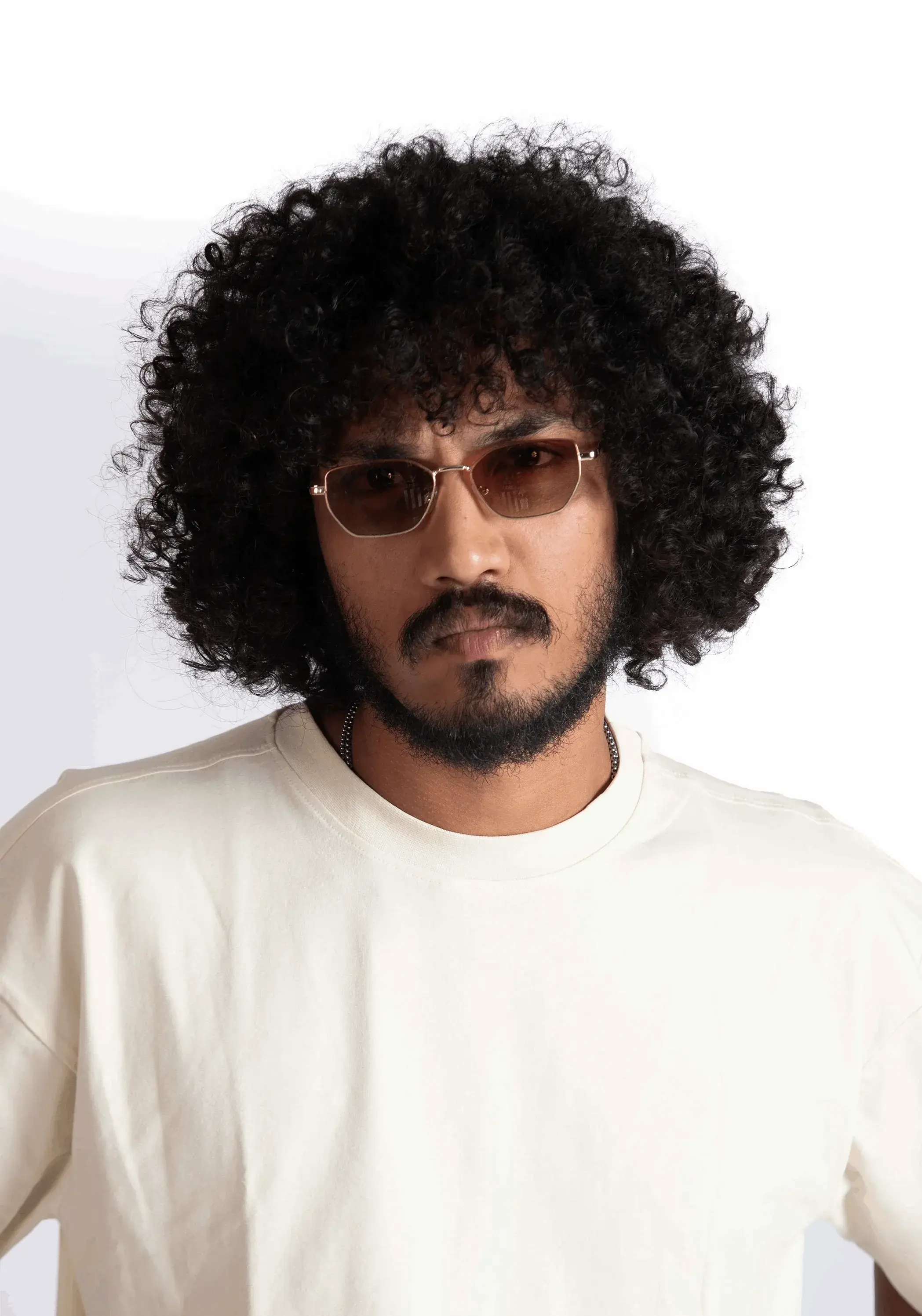 Man wearing Stylera oversized almond milk t-shirt with round neck and casual fit