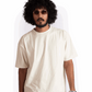 Man wearing Stylera oversized almond milk t-shirt with short sleeves and relaxed fit
