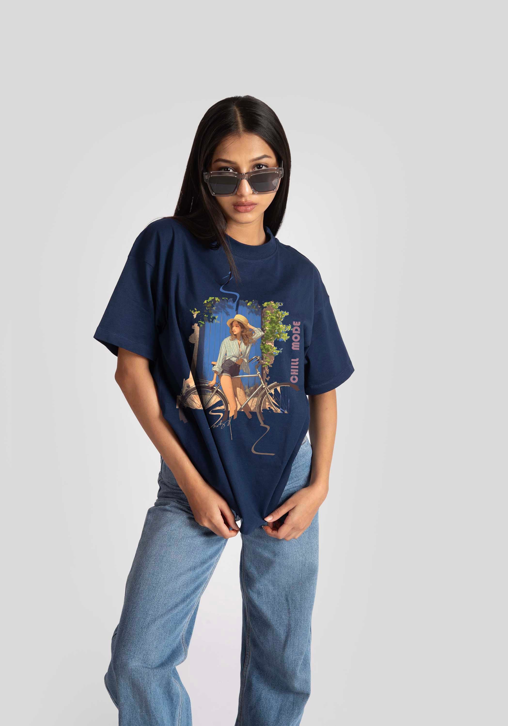 Stylera oversized blue graphic tee for womens styled with casual jeans and sunglasses