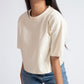 Stylera oversized crop top for women in beige paired with blue jeans and sunglasses