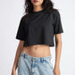 Stylera black oversized cropped t-shirt for women styled with light blue cargo jeans