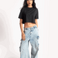 Stylera oversized cropped t-shirt for women in black paired with light blue wide-leg cargo jeans