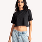Stylera black oversized cropped t-shirt for women paired with light wash denim cargo pants