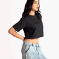 Stylera black oversized cropped t-shirt for women styled with light blue denim cargo pants