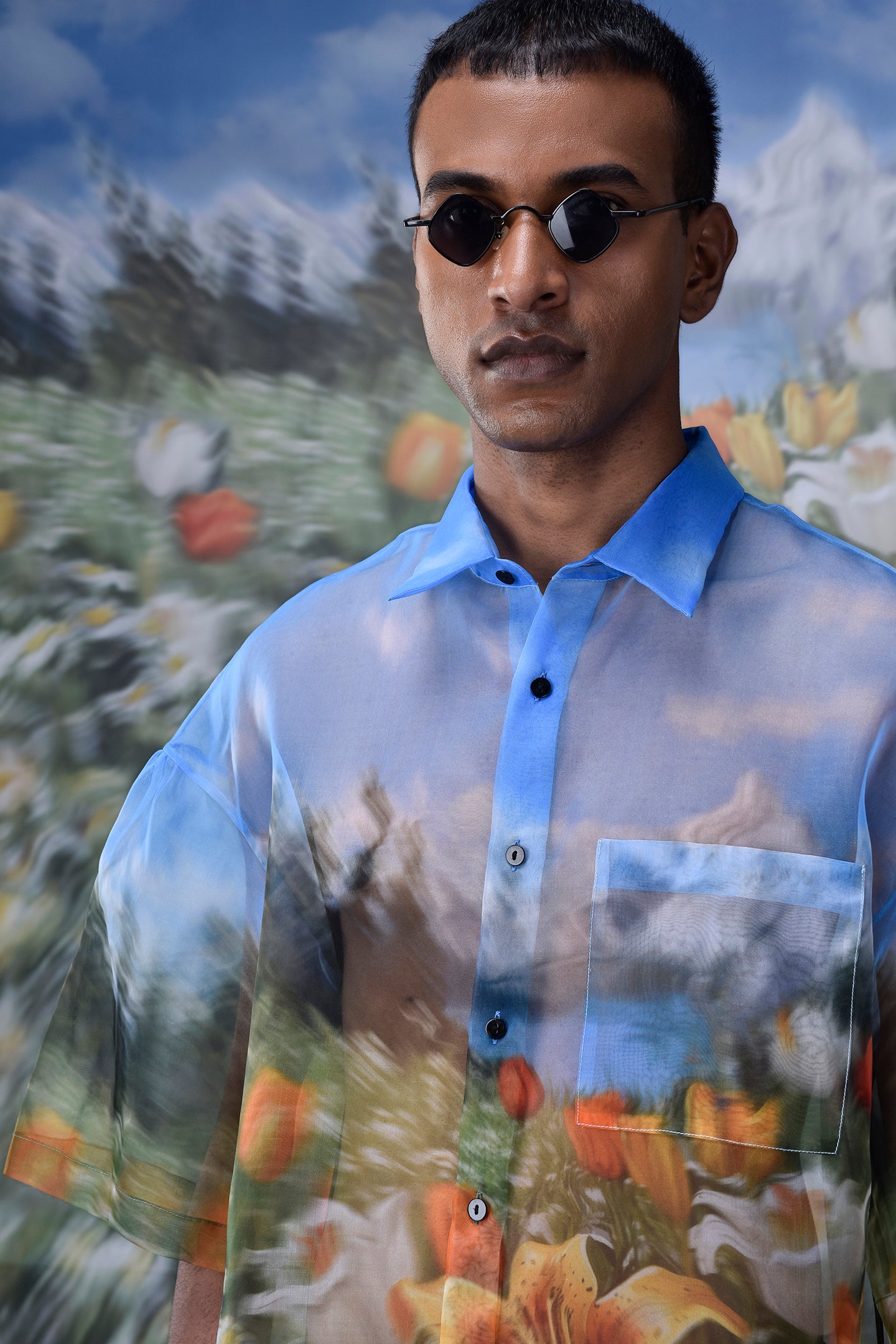 Stylera oversized floral button up shirt in blue with artistic floral print and black buttons