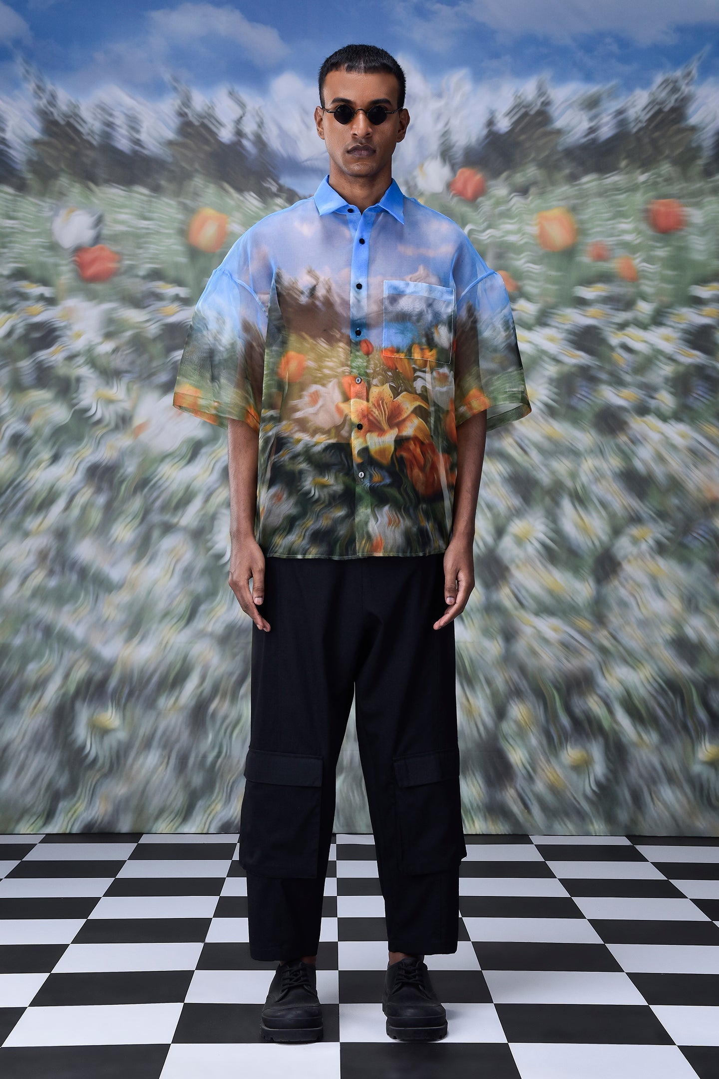 Stylera oversized floral button up shirt with vibrant flower print worn by male model