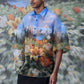 Stylera oversized floral button up shirt with blue sky and flower print on male model