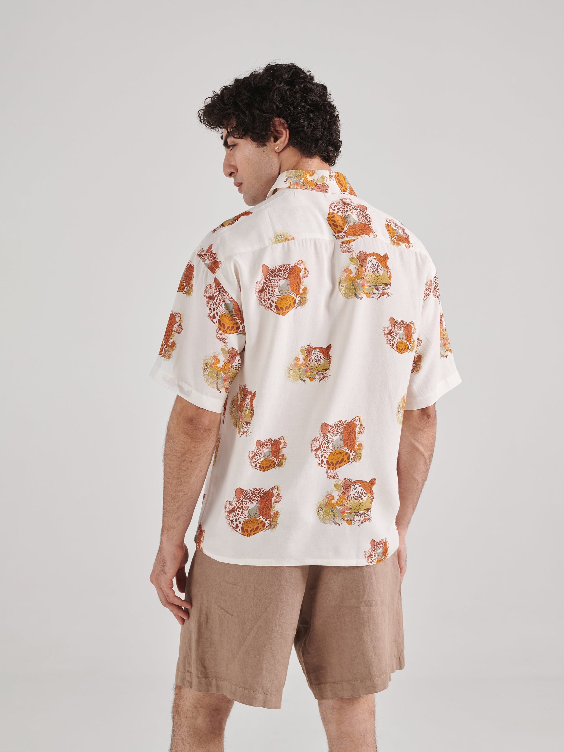 Men's oversized leopard shirt for men featuring a vibrant animal print and short sleeves