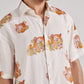 Men wearing an oversized leopard shirt for men with colorful leopard prints on a light background