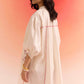 Stylera oversized off white dress with puffed sleeves and pink seam detailing on model