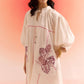 Stylera oversized off white dress with puffed sleeves and purple leaf print design