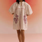 Stylera oversized off white dress with puff sleeves and floral print pockets