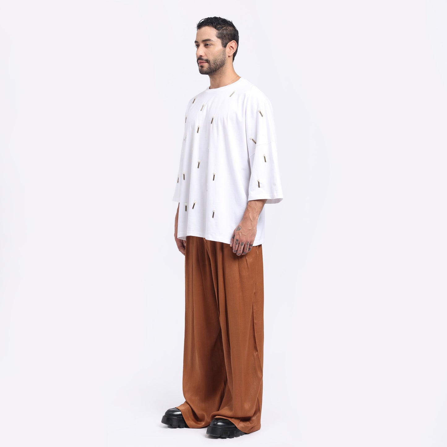 Stylera oversized white tee men styled with brown wide-leg pants for a casual look