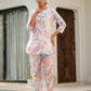Pastel floral cotton co ord set featuring a vibrant tunic and matching pants, perfect for casual outings.