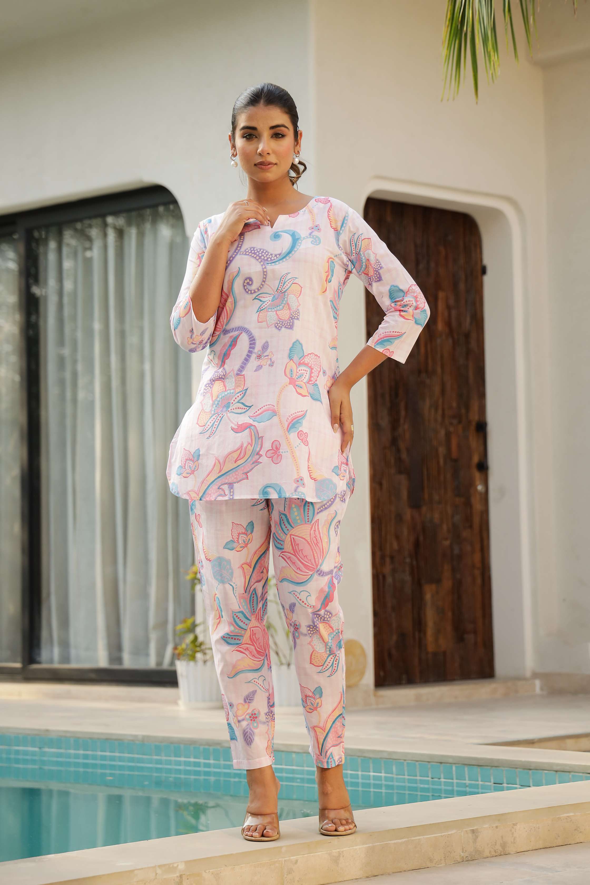 Pastel floral cotton co ord set featuring a vibrant tunic and matching pants, perfect for casual outings.