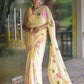 Pastel yellow floral saree for women with vibrant pink flowers and elegant draping style