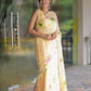 Elegant pastel yellow floral saree for women draped beautifully on a model outdoors