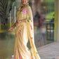 Pastel yellow floral saree for women with vibrant pink flower patterns draped elegantly