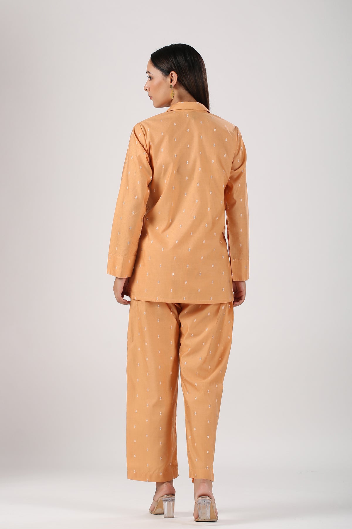 Back view of a peach Angrakha two piece outfit with a stylish design perfect for casual wear
