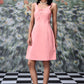Stylera peach casual dress with lace up front worn by model with black hair