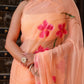 Elegant peach chiffon saree with floral design elegantly draped for a stunning look
