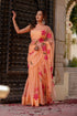 Elegant peach chiffon saree with floral design, perfect for festive occasions and celebrations