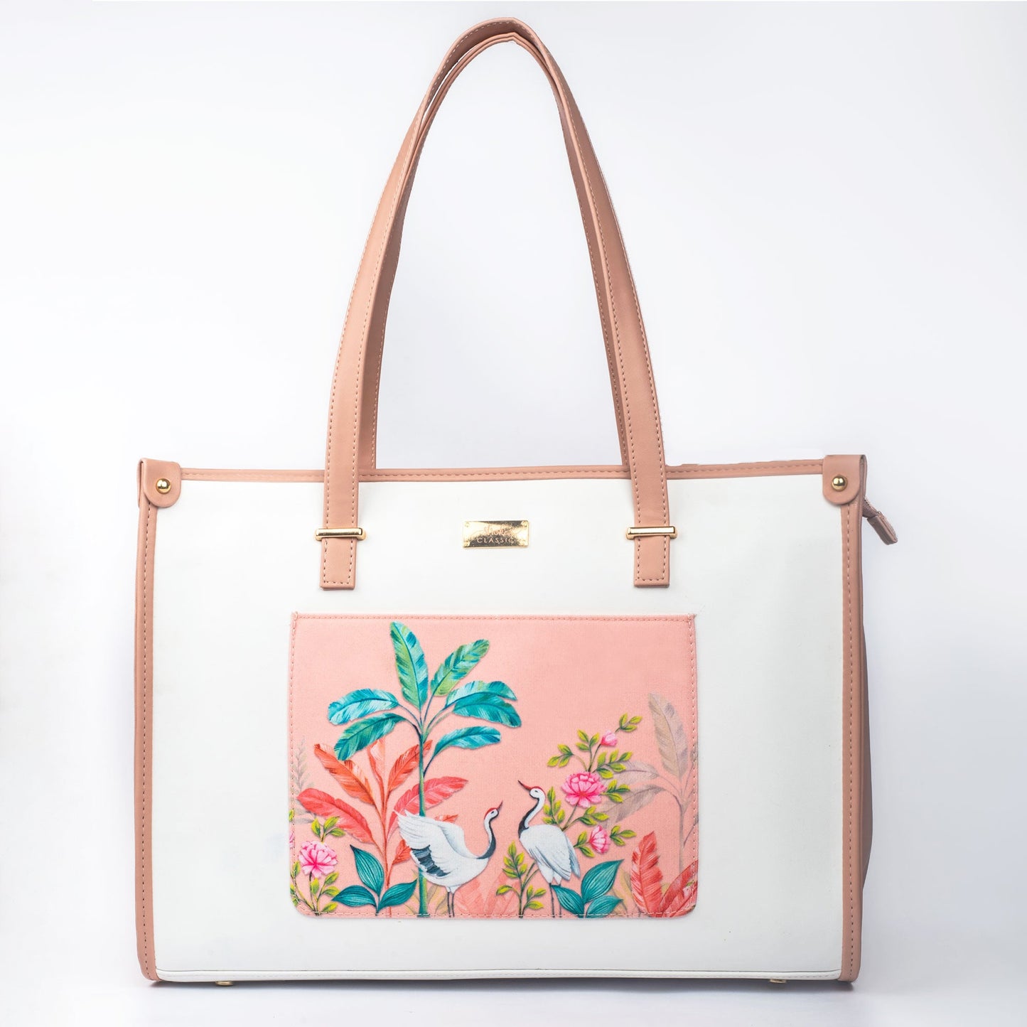 Stylish peach crane paradise tote bag with vibrant floral designs and elegant handles