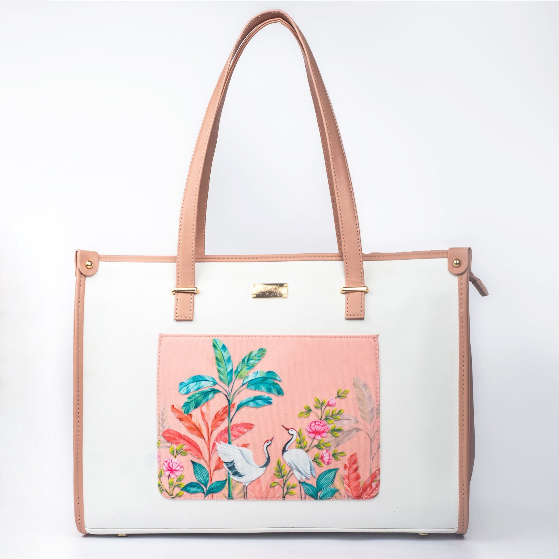 Stylish peach crane paradise tote bag with vibrant floral designs and elegant handles