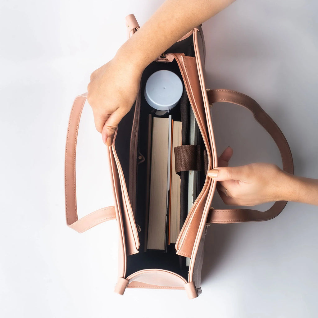 Interior view of a peach crane paradise tote bag showing spacious compartments for books and water bottle