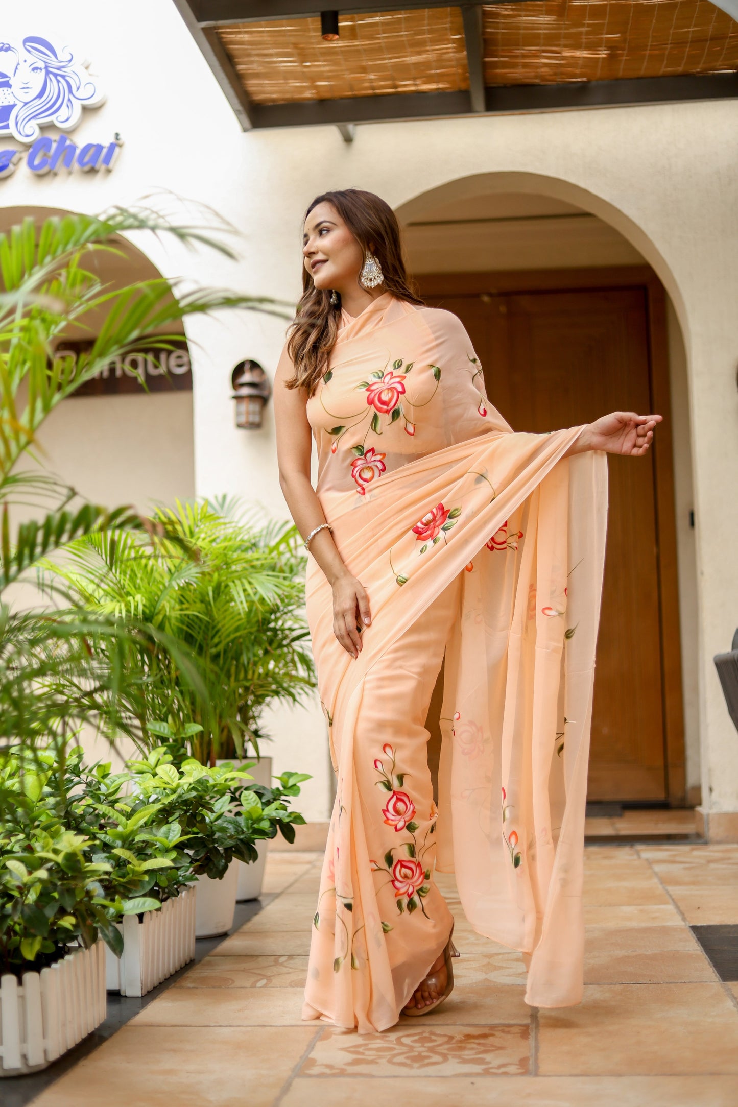 Elegant peach floral saree for women with intricate rose embroidery and a matching dupatta.