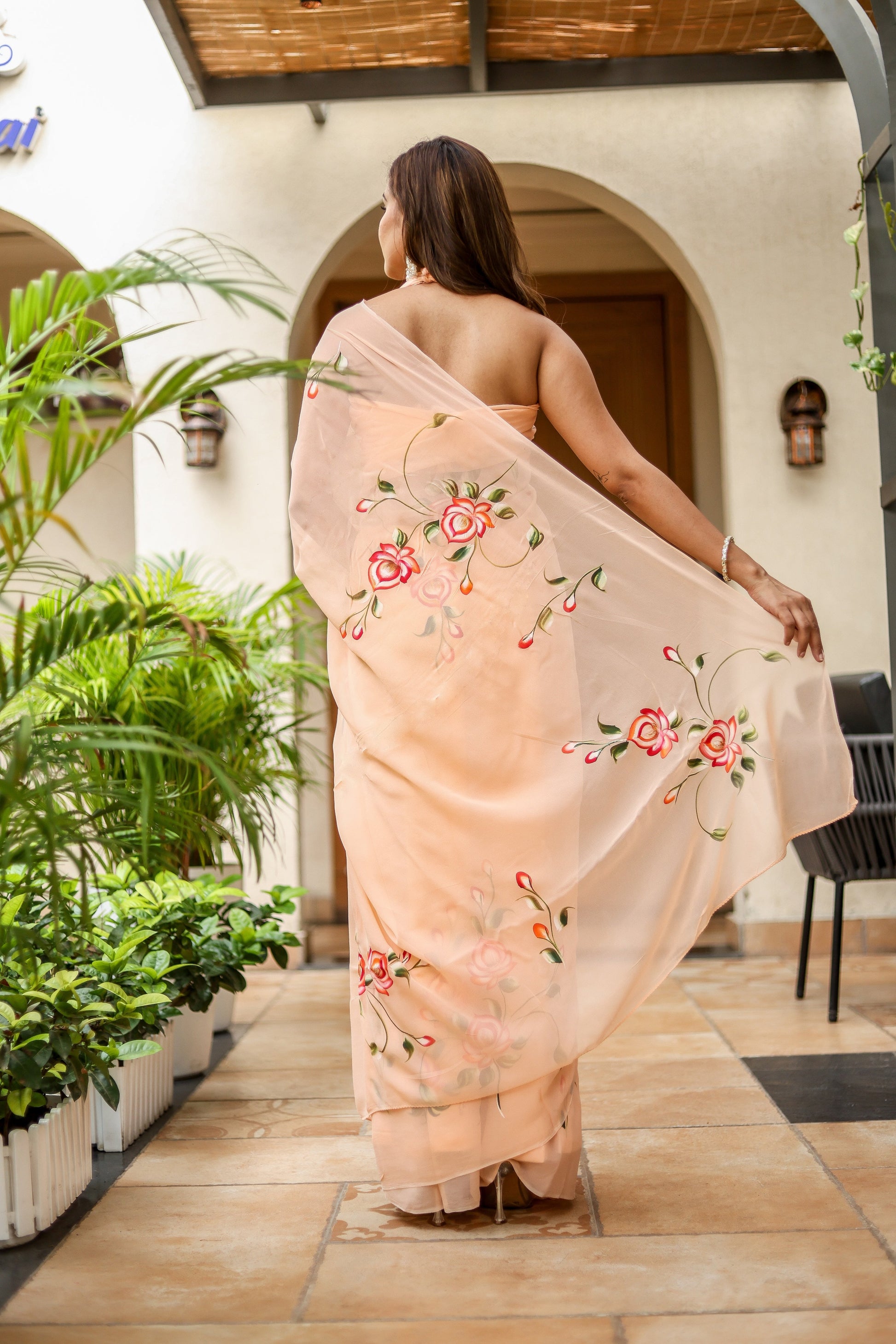 Elegant peach floral saree for women with vibrant embroidery, perfect for special occasions
