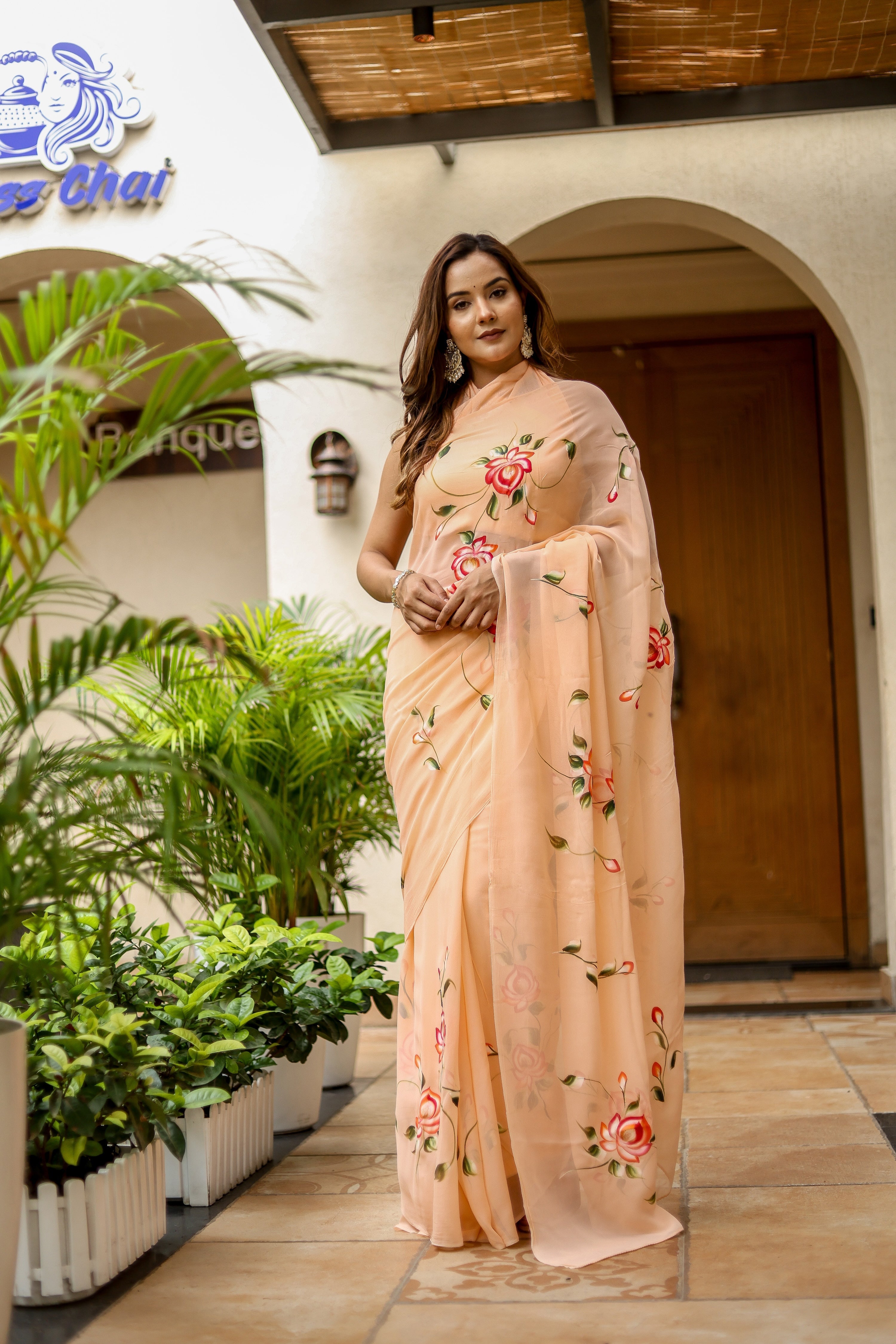 Elegant peach floral saree for women featuring delicate rose embroidery and a lightweight design