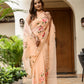 Elegant peach floral saree for women with intricate embroidery and graceful draping