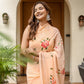 Elegant peach floral saree for women with intricate embroidery, perfect for festive occasions