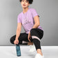 Women wearing a Pilates pink t-shirt featuring a stylish design with love in a workout setting