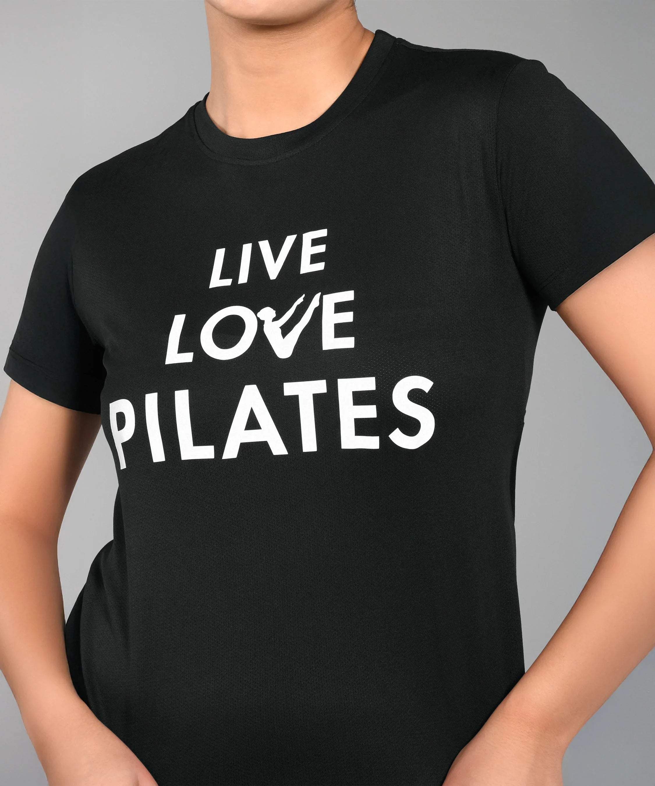 Black Pilates T shirt for women featuring 'Live Love Pilates' slogan in white lettering