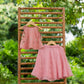 Pink festive skirt set featuring a matching top with floral embroidery and a flared skirt