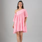 Stylera pink off shoulder dress tiered ruffle mini length relaxed fit summer sundress on model