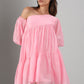 Model wearing Stylera pink off shoulder dress with puff sleeves tiered babydoll silhouette for summer