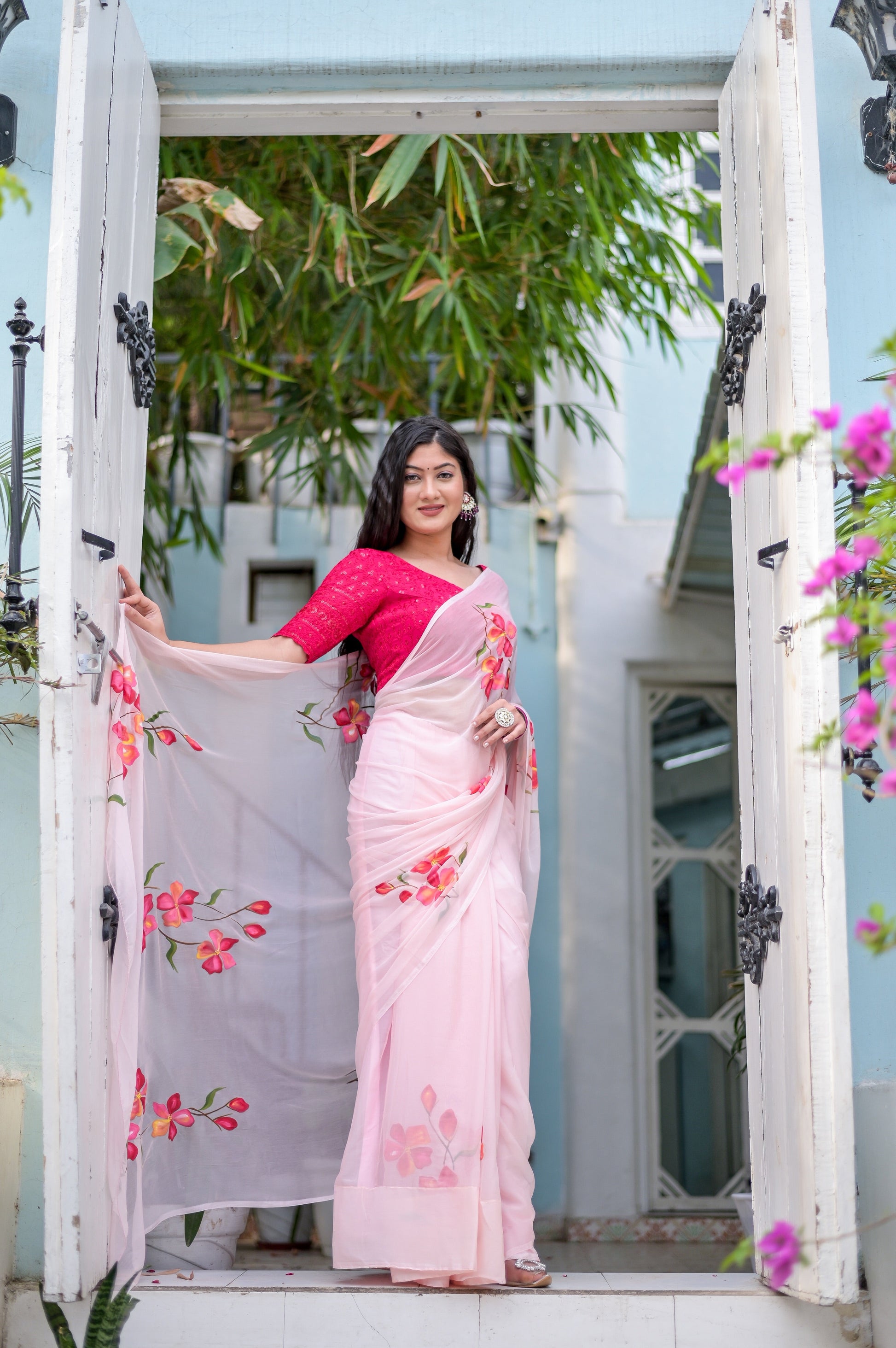 Elegant pink saree for women with floral embroidery, paired with a matching blouse for a stunning look