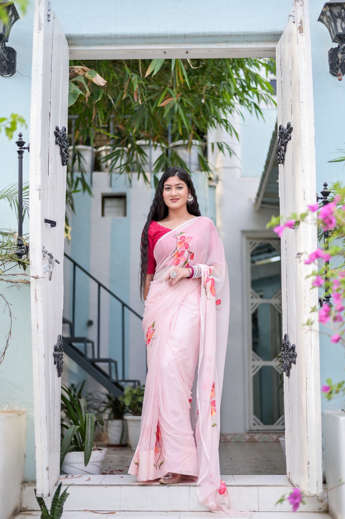 Elegant pink saree for women adorned with floral embroidery, perfect for festive occasions