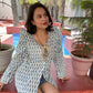 Stylish printed long sleeve shirt for women in blue and white pattern paired with denim shorts