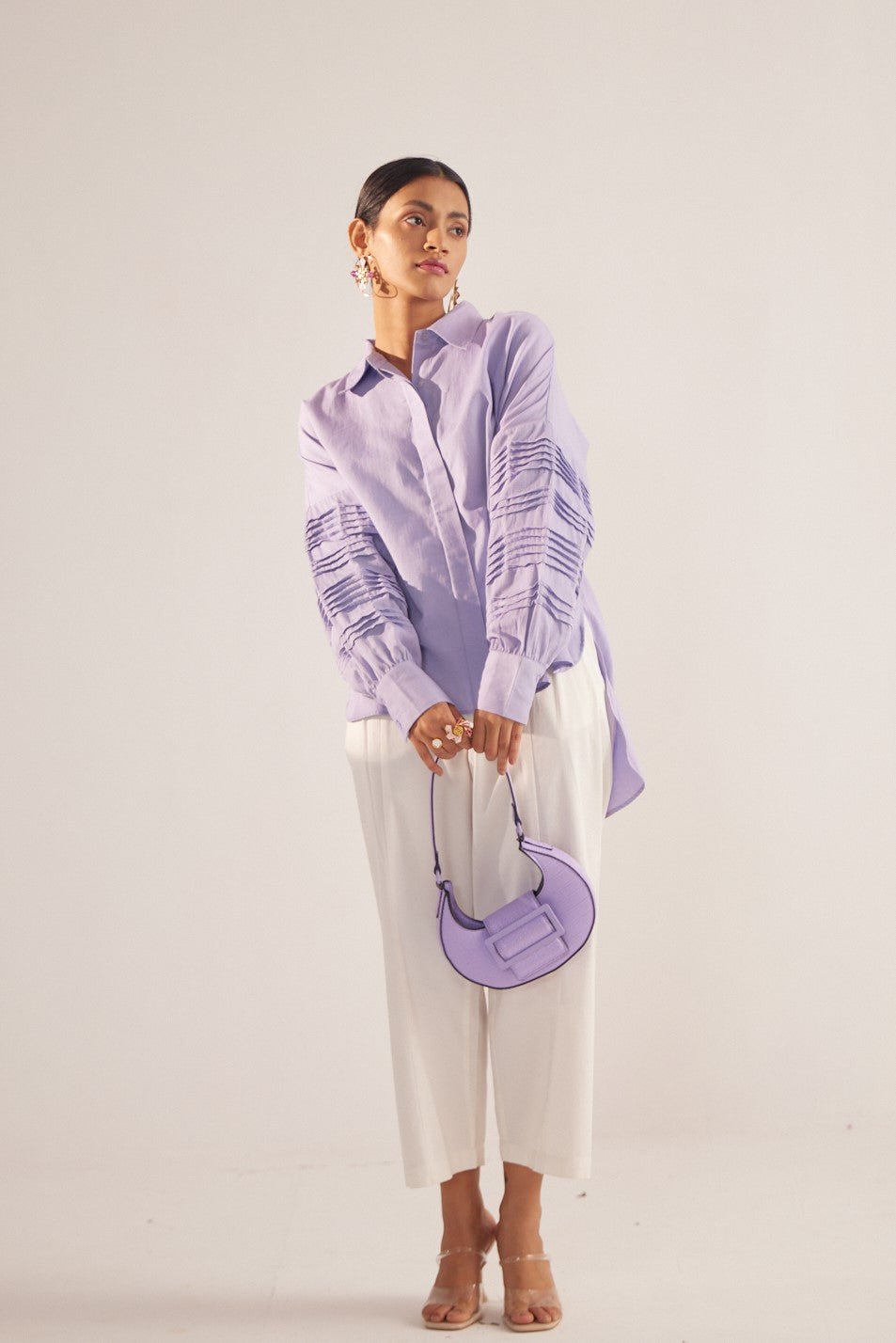 Stylera purple oversized cotton shirt with pleated sleeve details styled with white pants