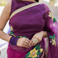 Elegant red and purple saree with handwork featuring floral designs and embellished borders