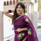 Beautiful red and purple saree with handwork, featuring floral designs and elegant accessories