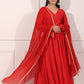 Elegant red festive Anarkali gown with flowing dupatta and intricate detailing for special occasions