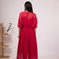 Elegant back view of a red flowy dress for women with a cinched waist and sheer fabric