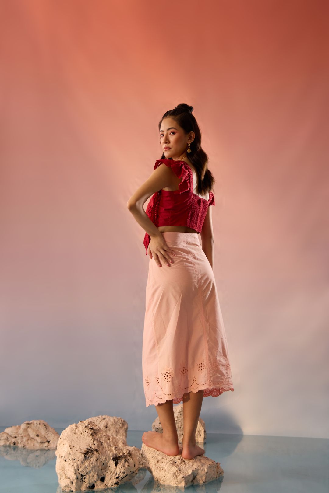 Stylera red top and skirt matching set with red sleeveless top and light pink skirt with cutout details