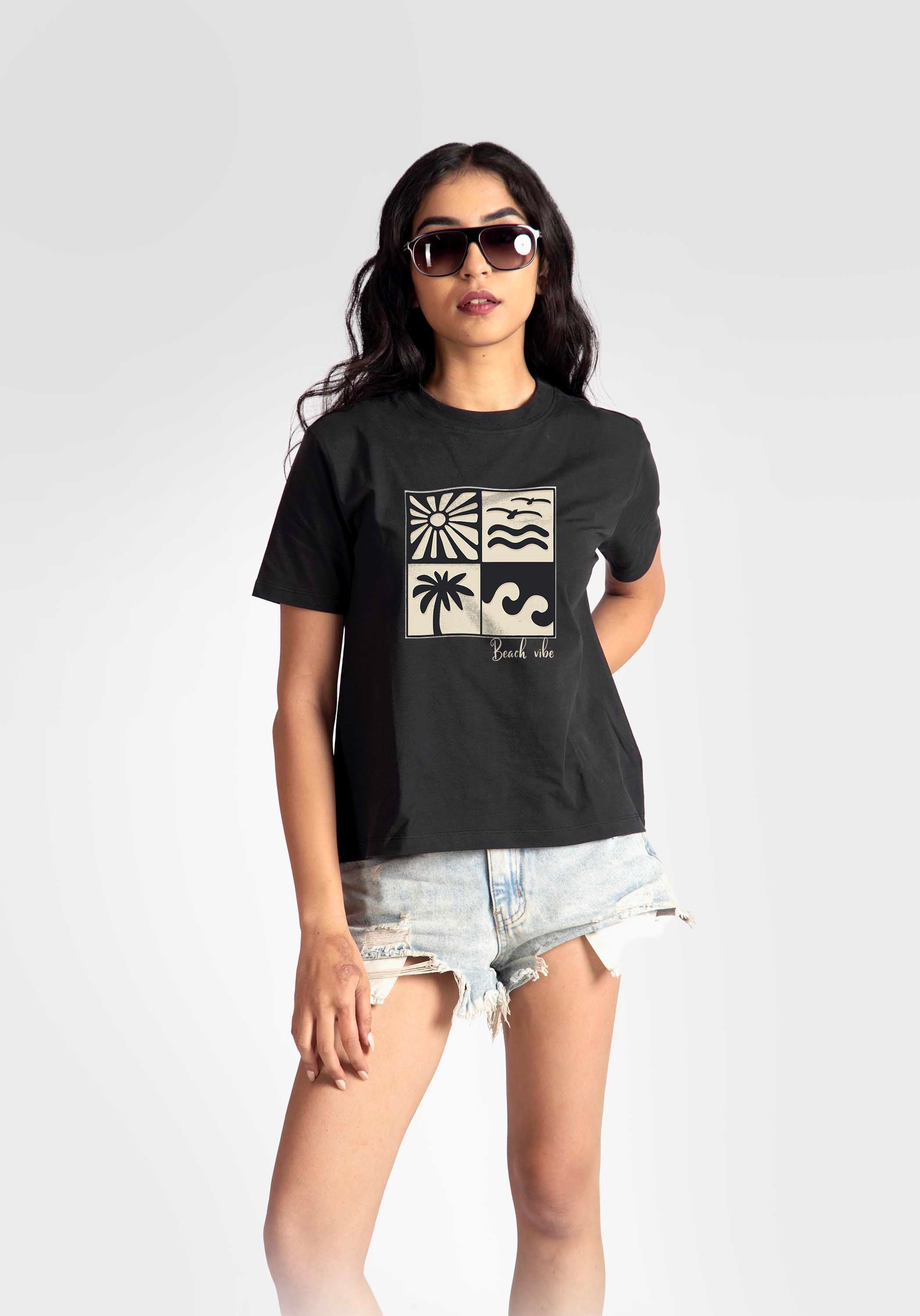 Stylera regular fit black t-shirt for women with graphic print worn with denim shorts